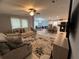 Inviting living room showcasing views into dining area and modern kitchen at 118 Jana Cir, Auburndale, FL 33823