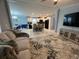 Inviting living space with views of the dining area and modern kitchen at 118 Jana Cir, Auburndale, FL 33823