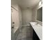 Cozy bathroom featuring a modern vanity, updated fixtures, and a tiled shower-tub at 1351 Pompay Dr, Davenport, FL 33896