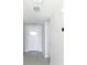 Clean, bright entryway featuring a stylish front door and modern lighting at 1351 Pompay Dr, Davenport, FL 33896