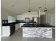 Modern kitchen featuring stainless steel appliances, granite countertops, and a stylish center island at 1351 Pompay Dr, Davenport, FL 33896
