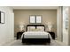 Relaxing bedroom with a dark modern bed, neutral decor, and soft lighting for a tranquil ambiance at 1918 Sarah Ln, Winter Haven, FL 33884