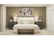 A stylish bedroom features neutral tones, modern art, and coordinating nightstands with lamps for a serene ambiance at 1918 Sarah Ln, Winter Haven, FL 33884