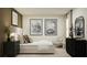 Stylish bedroom with a bed, modern decor, large window, and soft lighting for a serene ambiance at 1918 Sarah Ln, Winter Haven, FL 33884