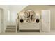 Inviting hallway featuring a stairs, decor with natural lighting at 1918 Sarah Ln, Winter Haven, FL 33884