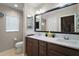 Bathroom featuring a double sink vanity with ample counter space and traditional fixtures at 5754 Shealy Ave, The Villages, FL 32163