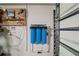 The garage has water filtration, an electrical outlet, and plenty of storage space at 5754 Shealy Ave, The Villages, FL 32163