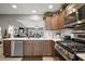 Modern kitchen featuring stainless steel appliances, ample counter space, and an open layout at 5754 Shealy Ave, The Villages, FL 32163