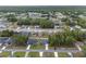 A scenic overhead shot presenting a peaceful residential area surrounded by plenty of trees and well-kept lawns at 6873 Sw 131St Pl, Ocala, FL 34473