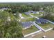 Aerial shot exhibiting the home's lot in a peaceful neighborhood surrounded by abundant greenery and nature at 6873 Sw 131St Pl, Ocala, FL 34473