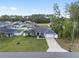 Aerial view of a single Gathering home with a large front yard and attached two car garage at 6873 Sw 131St Pl, Ocala, FL 34473