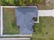 Aerial shot of the house showing roof, driveway, lawn, landscaping, and fencing at 6873 Sw 131St Pl, Ocala, FL 34473