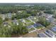 Aesthetic overhead shot highlighting a charming neighborhood surrounded by lush trees at 6873 Sw 131St Pl, Ocala, FL 34473