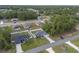 Wide angle aerial shot showing a serene neighborhood with the homes surrounded by abundant trees and nature at 6873 Sw 131St Pl, Ocala, FL 34473