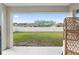 Backyard featuring a well-maintained lawn, privacy fence, and outdoor seating area at 6873 Sw 131St Pl, Ocala, FL 34473