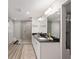 Modern bathroom featuring a glass shower, double sink vanity with black countertop at 6873 Sw 131St Pl, Ocala, FL 34473
