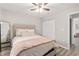 Cozy bedroom featuring a comfortable bed, ceiling fan, and closet at 6873 Sw 131St Pl, Ocala, FL 34473