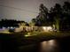 Charming single-story home with a well-manicured lawn, mature trees, and a two-car garage on a well-lit lot at 6873 Sw 131St Pl, Ocala, FL 34473