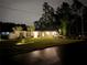 Charming single-story home with a well-manicured lawn, mature trees, and a two-car garage on a well-lit lot at 6873 Sw 131St Pl, Ocala, FL 34473