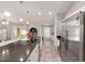 Well-lit kitchen boasts stainless steel appliances, granite countertops, and open access to living area at 6873 Sw 131St Pl, Ocala, FL 34473