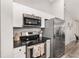Modern kitchen featuring stainless steel appliances, sleek countertops, and ample storage space at 6873 Sw 131St Pl, Ocala, FL 34473