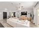 Cozy living room features modern decor, stylish furniture, and access to outdoor area at 6873 Sw 131St Pl, Ocala, FL 34473