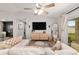 Open living room with modern decor, a TV, and access to outdoor patio at 6873 Sw 131St Pl, Ocala, FL 34473