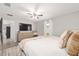 Cozy bedroom with large bed, natural color scheme, storage, and window at 6873 Sw 131St Pl, Ocala, FL 34473