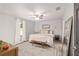 Bright main bedroom featuring a comfortable bed, neutral tones, and ample natural light at 6873 Sw 131St Pl, Ocala, FL 34473