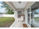Relaxing covered patio with outdoor furniture and a view of the backyard at 6873 Sw 131St Pl, Ocala, FL 34473