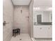 Modern shower with a tile surround, a bench, and glass doors to the vanities at 6873 Sw 131St Pl, Ocala, FL 34473