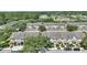 Community of townhomes with gray roofs, lush landscaping, and proximity to retail at 7752 Moser Ave, Windermere, FL 34786
