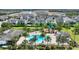 Aerial image of community pool and playground area surrounded by lush greenery, offering a Gathering-friendly atmosphere at 7752 Moser Ave, Windermere, FL 34786