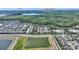 Aerial view of townhomes with proximity to Disney attractions and lakes at 7752 Moser Ave, Windermere, FL 34786