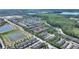 Aerial of townhome community with lake views and greenery at 7752 Moser Ave, Windermere, FL 34786