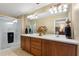 Bright bathroom features double sinks with ample counter space and a glass-enclosed shower at 7752 Moser Ave, Windermere, FL 34786