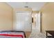 Neutral bedroom with closet and doorway leading to hallway at 7752 Moser Ave, Windermere, FL 34786