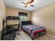 Bedroom with a modern work space, neutral carpet and a ceiling fan at 7752 Moser Ave, Windermere, FL 34786