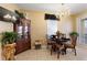 Charming dining area features a chandelier, dining table, and classic decorative pieces at 7752 Moser Ave, Windermere, FL 34786