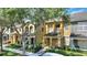 Two-story townhome with covered entry, and landscaped front yard at 7752 Moser Ave, Windermere, FL 34786