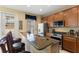 Kitchen boasts granite countertops, stainless steel appliances, and breakfast bar seating at 7752 Moser Ave, Windermere, FL 34786