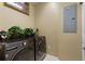 Functional laundry room featuring modern washer and dryer units at 7752 Moser Ave, Windermere, FL 34786