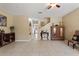 A open-concept living room featuring tile floors and decorated furniture at 7752 Moser Ave, Windermere, FL 34786