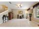 A bright and airy living room with tile flooring, neutral walls, and decorative accents at 7752 Moser Ave, Windermere, FL 34786