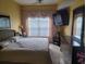 Bedroom featuring carpet, a large window, and a ceiling fan at 2605 Gala S Rd, Kissimmee, FL 34746