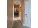 Hallway with tile flooring and leads to bathroom at 2605 Gala S Rd, Kissimmee, FL 34746