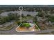 Aerial view of property outlined showing proximity to lake and surrounding neighborhood at 995 Merrimac St, Deltona, FL 32725