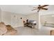 The living room features tile floors, neutral walls and a ceiling fan at 995 Merrimac St, Deltona, FL 32725