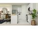 Bright, white kitchen featuring stainless steel appliances, island with seating and modern decor at 2026 Lasso Loop, Eagle Lake, FL 33839