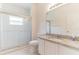 Bathroom featuring tiled shower, granite countertop and plenty of light at 2433 Huron Cir, Kissimmee, FL 34746